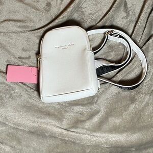 Nica White Pebbled Crossbody Phone Bag with Black-Trim Strap